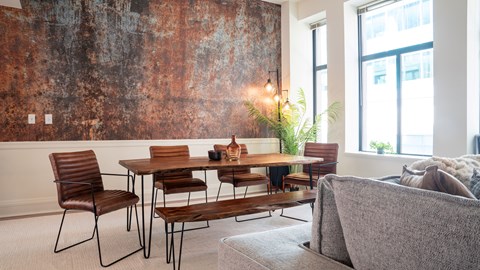 a dining room with a table and chairs and a large wall mural at Market Square Place, Pennsylvania